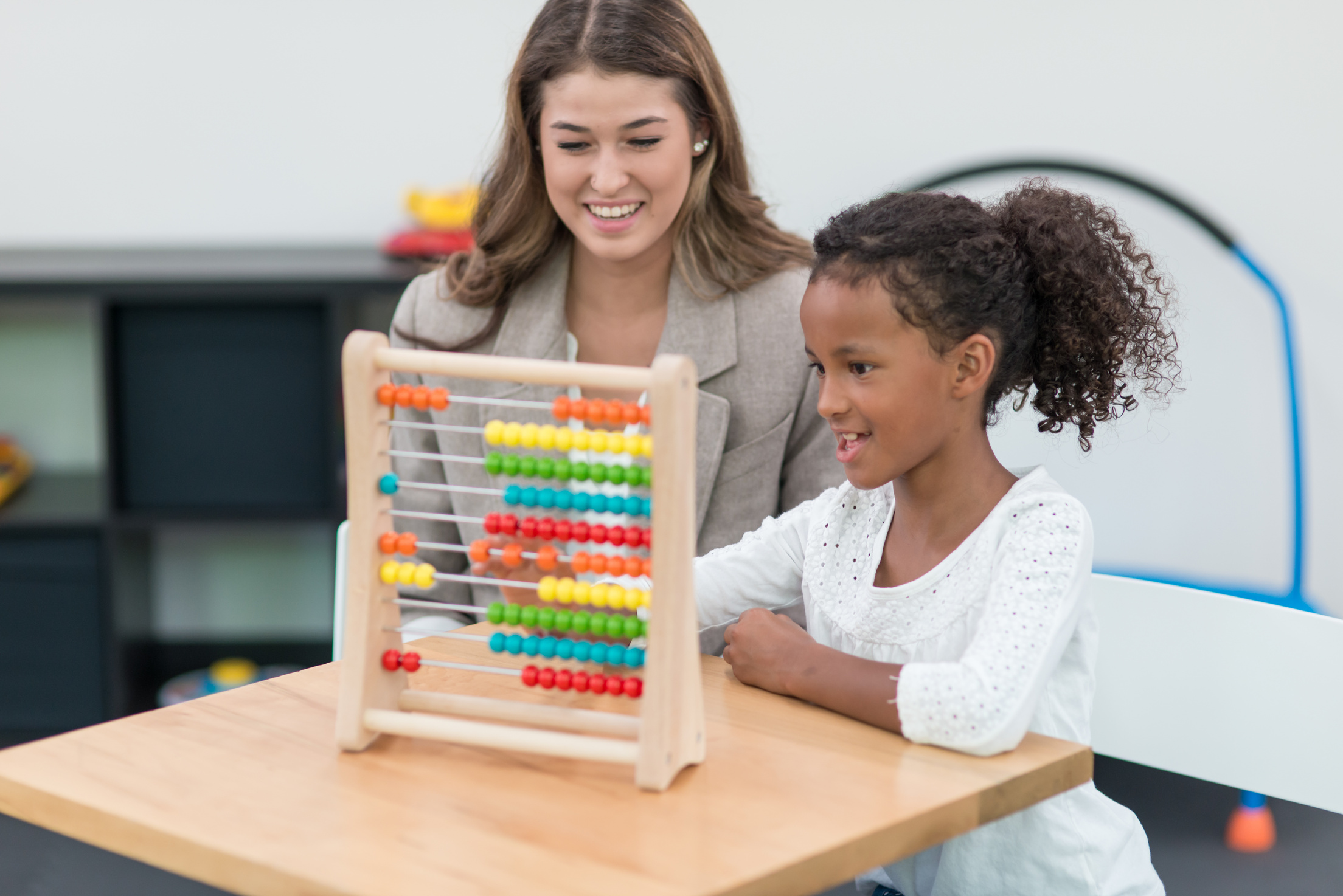 Therapist doing play therapy with young girl