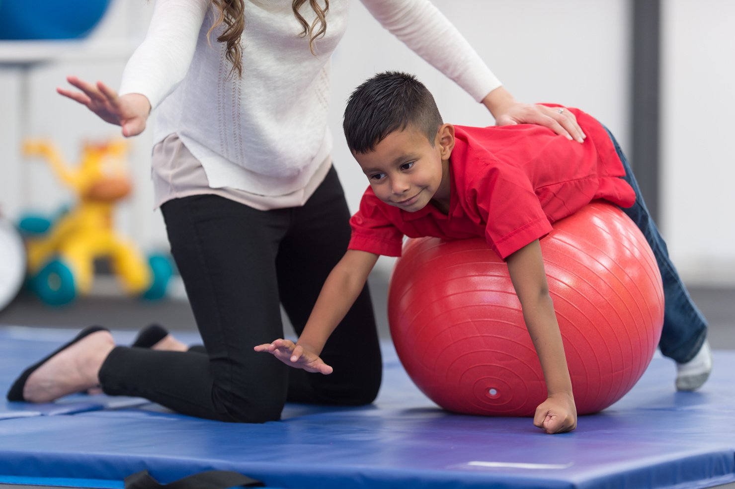 Kids exercising in physical therapy clinic